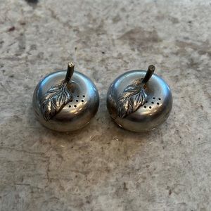 Two salt and pepper shakers